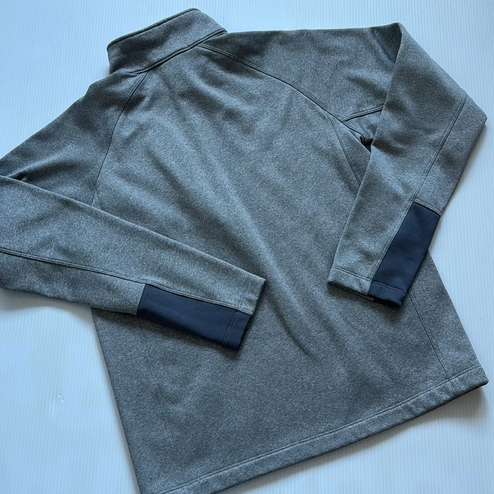 The North Face Men’s gray quarter zip with blue details.  Size medium